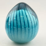 Striped Turquoise and White Easter Egg Paperweight